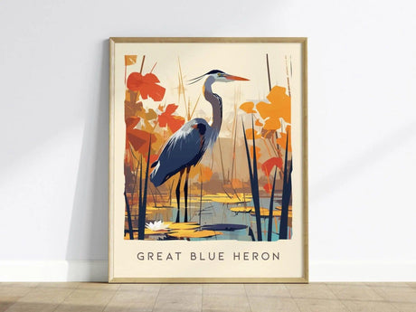 A framed art print featuring a stylized Great Blue Heron standing in a serene wetland scene, surrounded by vibrant orange and red foliage.