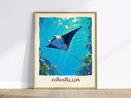 A framed poster depicts a graceful manta ray swimming through clear blue waters, surrounded by vibrant coral and aquatic plants. Sunlight streams down, enhancing the serene underwater scene with the word Hahalua featured prominently below.