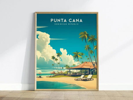 Framed poster of Punta Cana, Dominican Republic, featuring a vibrant beach scene with palm trees, lounge chairs, and a beachside villa under a clear blue sky. The art captures the serene beauty of a tropical paradise.