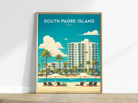 A framed poster of South Padre Island, Texas, features a vibrant coastal scene with tall palm trees, a modern hotel, and beach chairs overlooking the turquoise ocean.