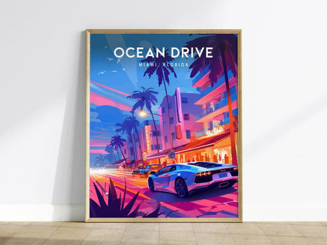 A framed poster of Ocean Drive in Miami, Florida, featuring vibrant neon colors, palm trees, and a sleek sports car. The artwork captures the lively ambiance of a tropical night scene.