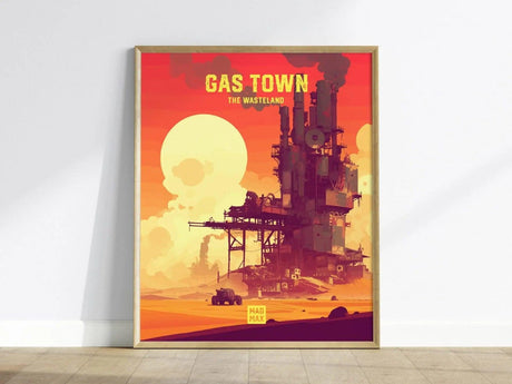 A vibrant poster titled Gas Town, The Wasteland features a stylized industrial scene with an oil refinery surrounded by a desert landscape. The background showcases a large sun setting in a colorful sky, emphasizing the dystopian theme.