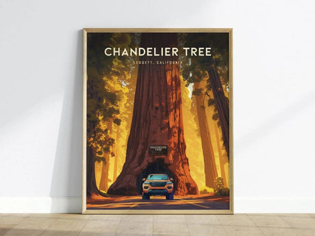 A framed poster of the Chandelier Tree in Leggett, California, showcases a towering redwood with a vehicle parked beneath it. The artwork highlights the trees grandeur, surrounded by lush green foliage.