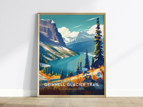 Framed poster of Grinnell Glacier Trail depicts vibrant alpine scenery with lush meadows, turquoise lakes, and towering peaks, set against a neutral wall.