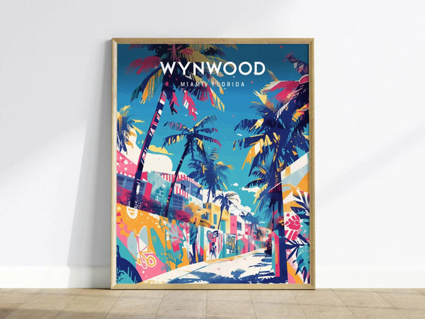 A vibrant poster of Wynwood, Miami, featuring colorful palm trees and street art under a bright blue sky. The artwork captures the lively essence of Miamis art district, displayed in a wooden frame against a plain wall.