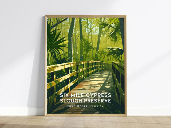 A framed poster of Six Mile Cypress Slough Preserve features a wooden boardwalk amidst lush green foliage and towering trees. Text reads Six Mile Cypress Slough Preserve, Fort Myers, Florida.