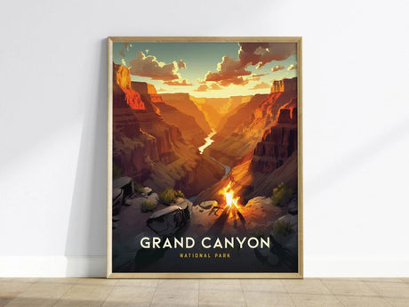 A framed poster depicting the Grand Canyon at sunset, featuring vibrant orange and red hues, with a campfire in the foreground. Text reads Grand Canyon National Park.