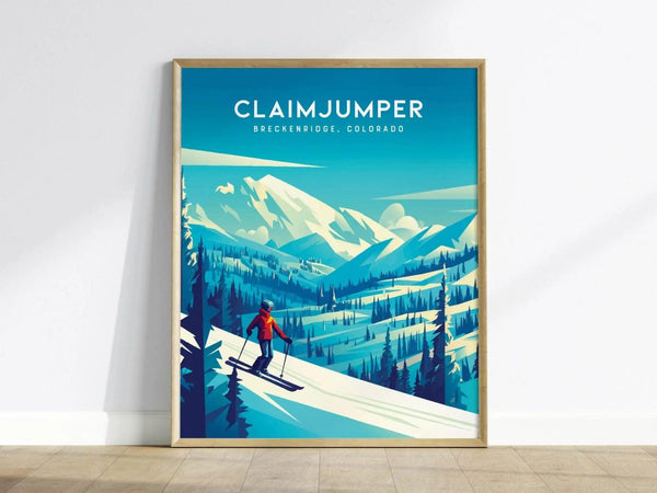 A framed poster of Breckenridge, Colorado, titled Claimjumper, shows a skier on a snowy slope with mountains and pine trees under a bright blue sky.