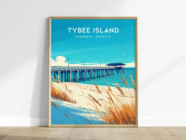 A framed poster of Tybee Island, Georgia, features a vibrant illustration of a fishing pier extending into the calm blue ocean. The foreground includes sandy dunes adorned with golden sea oats, capturing the coastal charm of the area.