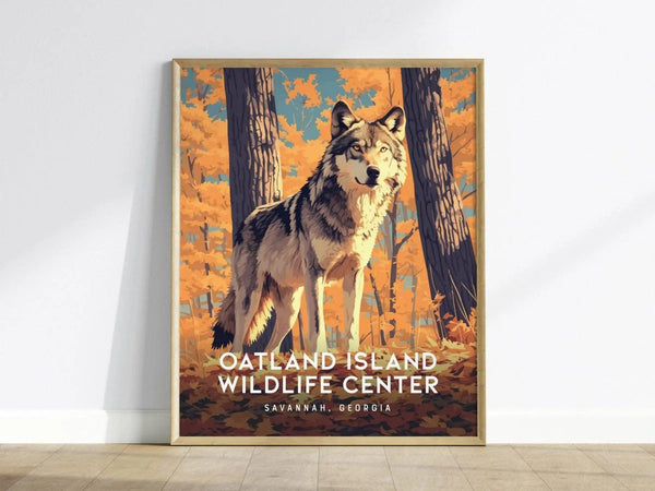 A framed poster depicting a wolf standing in a vibrant autumn forest with orange foliage. The text reads Oatland Island Wildlife Center, Savannah, Georgia.