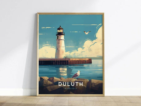 Framed poster featuring a white lighthouse with a black top, set against a blue sky and ocean, with seagulls flying. Text reads Duluth, Minnesota.
