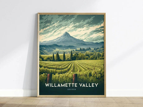 Framed poster of Willamette Valley, Oregon, featuring illustrated vineyard rows with a mountainous backdrop under a dramatic sky. The artwork captures the regions lush, scenic beauty.