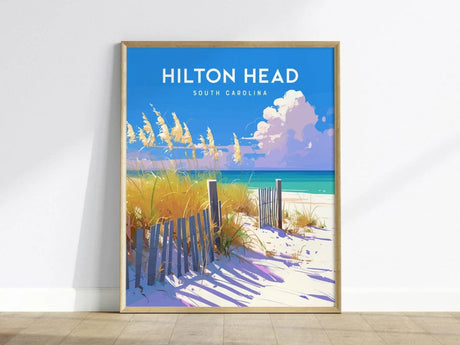 A vibrant poster featuring Hilton Heads Coligny Beach, showcasing golden dunes with tall grasses and a wooden fence against a bright blue sky.