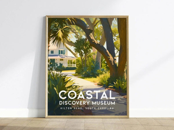 A framed poster of the Coastal Discovery Museum featuring a scenic path lined with lush greenery and trees, leading to a white Southern-style house under a clear sky.