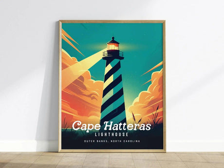 Framed poster of Cape Hatteras Lighthouse with a black-and-white spiral design, set against a vibrant sky with orange clouds. Text reads Cape Hatteras Lighthouse, Outer Banks, North Carolina.
