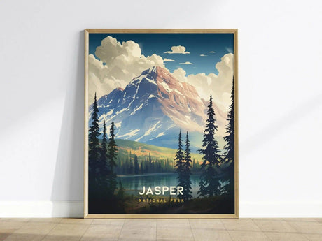 A framed poster of Jasper National Park features a majestic mountain with snow-capped peaks, surrounded by evergreen trees and a serene lake under a partly cloudy sky.