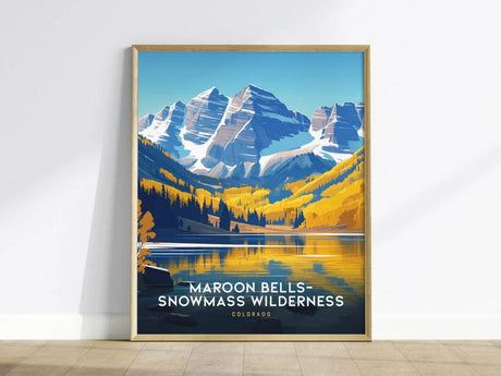 Framed poster of Maroon Bells-Snowmass Wilderness features vibrant blue and yellow tones, depicting snow-capped mountains and a reflective lake. The text Maroon Bells-Snowmass Wilderness, Colorado is visible.