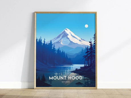 A framed poster of Mount Hood features a snow-capped peak, forested foothills, and a serene lake under a bright sky, creating a tranquil landscape scene.