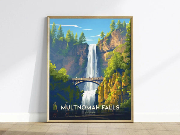 Framed poster depicting Multnomah Falls with a two-tier waterfall, lush green cliffs, and the Benson Bridge under a clear blue sky, leaning against a white wall.