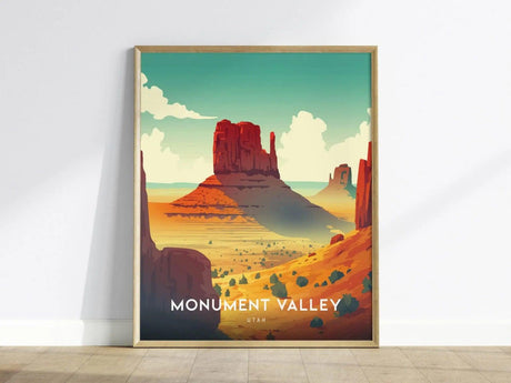 A vibrant poster of Monument Valley features iconic red sandstone mesas and the Mitten Buttes under a wide-open sky, framed in a light wood frame.
