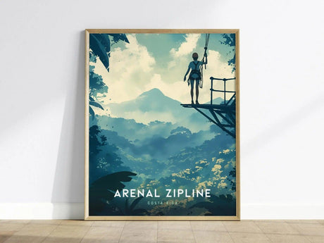 A framed poster depicts a person on a zipline platform overlooking a lush rainforest with a distant volcano under a cloudy sky, titled Arenal Zipline Costa Rica.