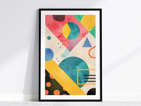 A framed abstract art piece features vibrant geometric shapes, including circles, triangles, and rectangles in a colorful palette of pink, blue, yellow, and green.