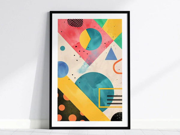 A framed abstract art piece features vibrant geometric shapes, including circles, triangles, and rectangles in a colorful palette of pink, blue, yellow, and green.