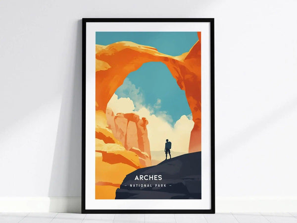 Framed minimalist poster of Arches National Park featuring Delicate Arch. A lone hiker stands beneath the arch against a vivid blue and orange desert sky.