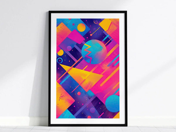 Framed poster featuring vibrant geometric shapes in electric pinks, blues, and yellows against a dark background, capturing a retro 80s and 90s synthwave aesthetic.
