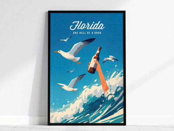 A vibrant poster featuring a stylized beach scene with seagulls soaring above and waves crashing. The design prominently displays the text Florida - One Hell of a Drug alongside an arm holding a beer bottle, capturing the fun,.