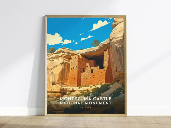 Framed poster depicting Montezuma Castle National Monument with a vibrant blue sky and detailed cliff dwelling. The artwork features bold colors and clear text at the bottom.