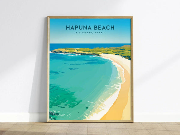 A framed poster of Hapuna Beach, Big Island, Hawaii, featuring turquoise waters, white sandy shores, and lush greenery under a clear blue sky, leaning against a white wall.