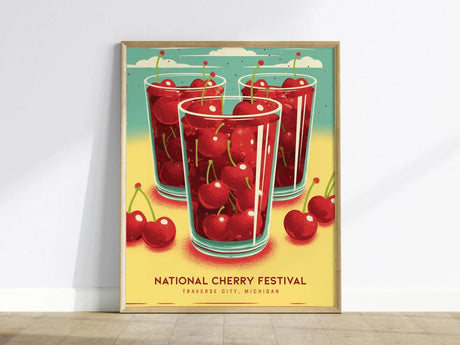 Bright poster featuring three glasses filled with cherries against a vibrant backdrop, labeled National Cherry Festival, Traverse City, Michigan. Vivid colors evoke a festive, summery atmosphere.