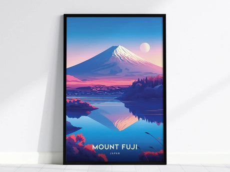A framed poster of Mount Fuji with a snow-capped peak is set against a vibrant sunset, reflected in calm waters, with Mount Fuji, Japan text at the bottom.