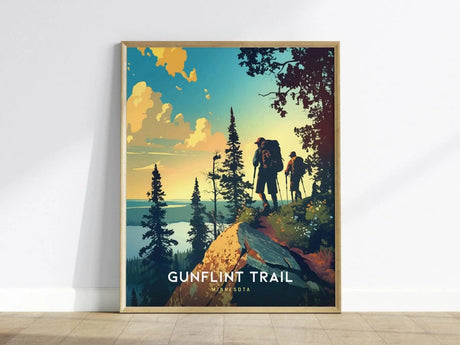 Illustrated poster of two hikers on a forested trail with a sunset sky and lake in the background, labeled Gunflint Trail, Minnesota. Vibrant colors enhance the scenic beauty.