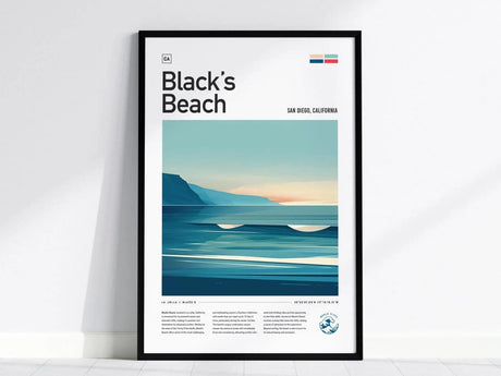 Framed poster of Blacks Beach featuring a minimalist design with ocean waves and cliffs, set against a gradient sky. Text includes location details of San Diego, California.
