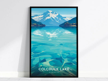 Framed poster of Colchuck Lake, Washington, featuring turquoise waters and a snowy mountain backdrop under a clear blue sky. The vibrant artwork captures a serene, natural landscape.