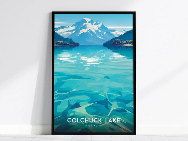 Framed poster of Colchuck Lake, Washington, featuring turquoise waters and a snowy mountain backdrop under a clear blue sky. The vibrant artwork captures a serene, natural landscape.