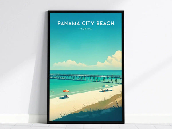 A framed poster of Panama City Beach, Florida, featuring a pier, turquoise water, white sand, and beachgoers under umbrellas, set against a clear blue sky.