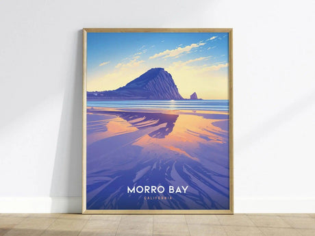 Framed poster featuring a vibrant illustration of Morro Bay with Morro Rock in the background, reflecting warm sunset colors on calm waters. The text reads Morro Bay, California.