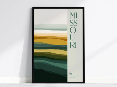 Framed Missouri poster with abstract layered color bands in green, yellow, and beige tones, featuring vertical Missouri text. Ideal for modern decor.