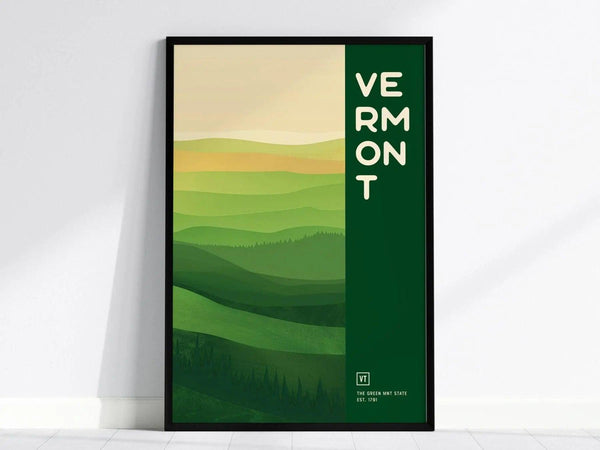 Framed poster featuring a minimalist design of rolling green hills with the word Vermont vertically aligned. The artwork captures the essence of Vermonts landscapes.