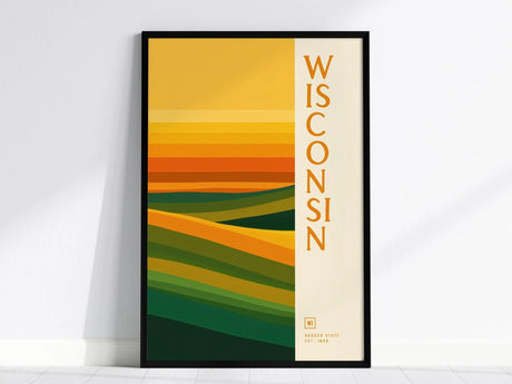 Framed poster featuring abstract geometric layers in green and gold, with the word Wisconsin vertically on the right. The design evokes the states natural landscapes.