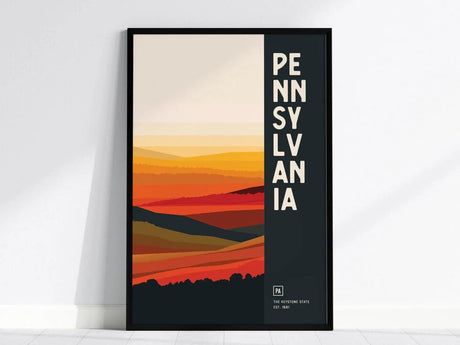 Framed abstract poster featuring Pennsylvanias landscape in warm tones with bold vertical text PENNSYLVANIA on the right. Minimalist design with a modern aesthetic.
