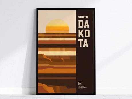 A minimalist South Dakota poster featuring geometric shapes and earthy tones, with a stylized sun setting over abstract landscape layers. The text South Dakota is prominently displayed.