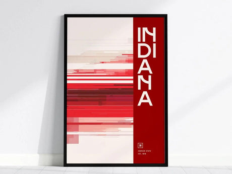 A modern Indiana poster features bold red and white horizontal lines, with INDIANA written vertically in white text on a red background. The artwork is displayed in a black frame.