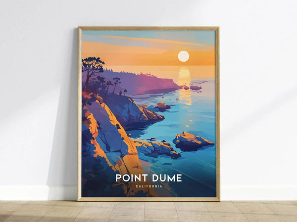 Framed poster depicting a colorful sunset over Point Dume, California, with dramatic cliffs and the Pacific Ocean. Sunlight reflects on the water, creating a serene coastal scene.