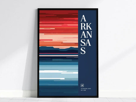 A minimalist poster featuring abstract horizontal lines in shades of red, orange, and blue, with ARKANSAS text vertically on the right side, framed against a light wall.