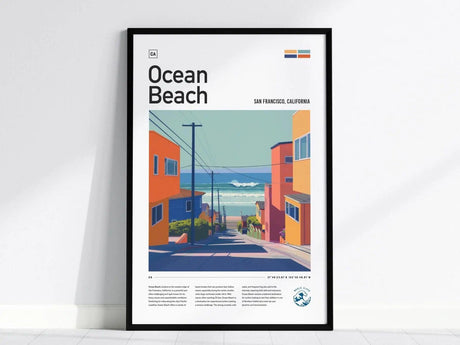 Framed illustration of Ocean Beach in San Francisco, featuring colorful homes and a view of the ocean waves. The artwork uses bold, pastel tones and modern design elements.
