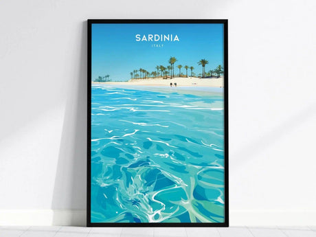 A framed poster of Sardinia, Italy, depicting vibrant turquoise waters and a sandy beach lined with palm trees under a clear blue sky.
